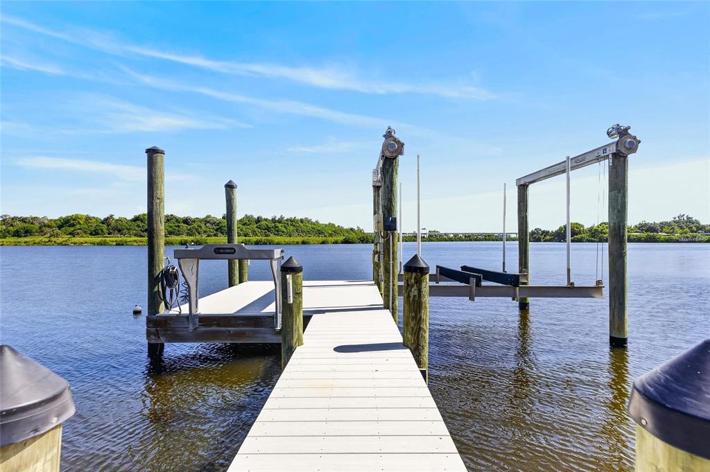 Deeded dock with power, water and fish-cleaning station at 6712 Myrna Drive