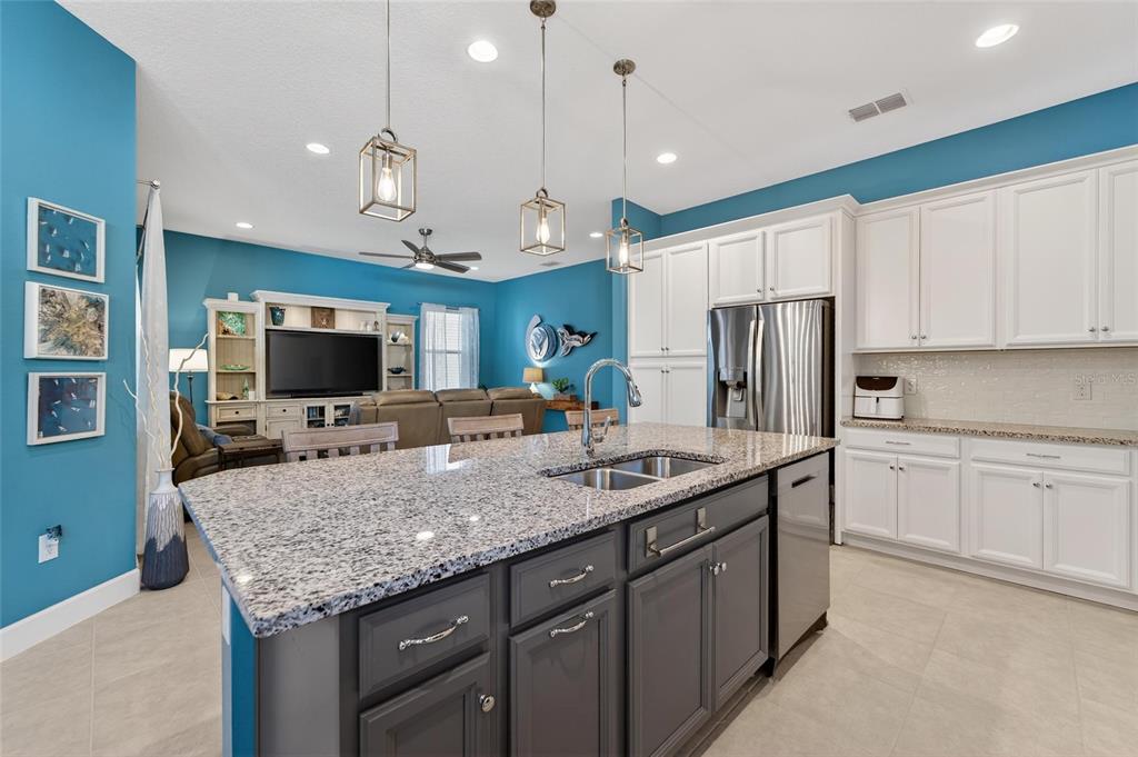 Kitchen with granite, double ovens and gas cooktop