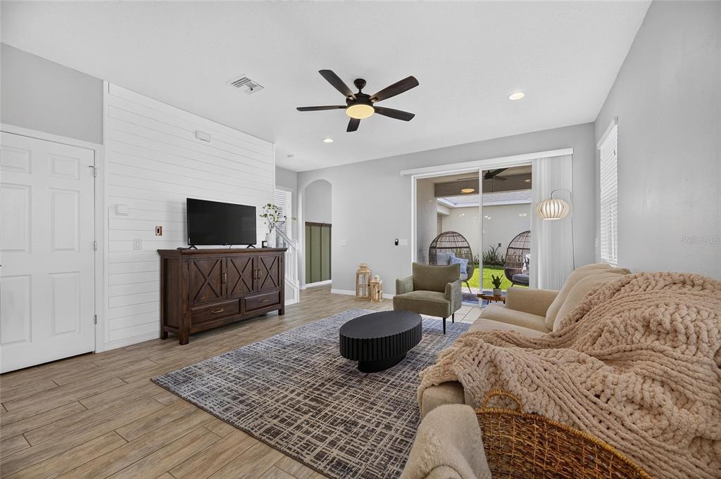 Living room with custom wood wall detail