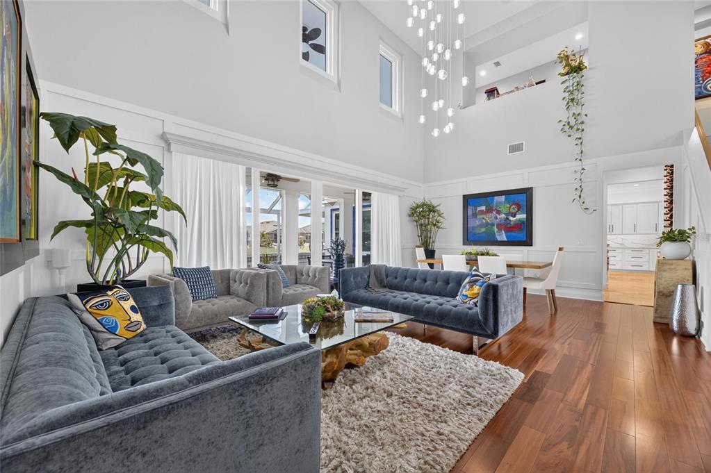 Great room with hardwood floors and canal views at 713 Islebay Drive