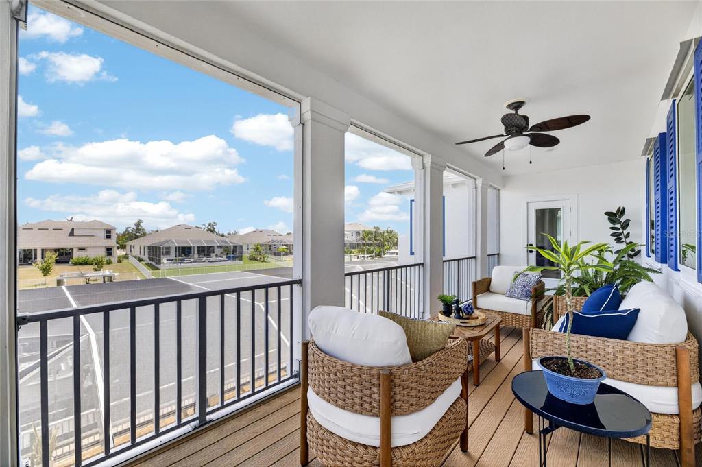 Private balcony off the upstairs bonus room with canal views at 713 Islebay Drive