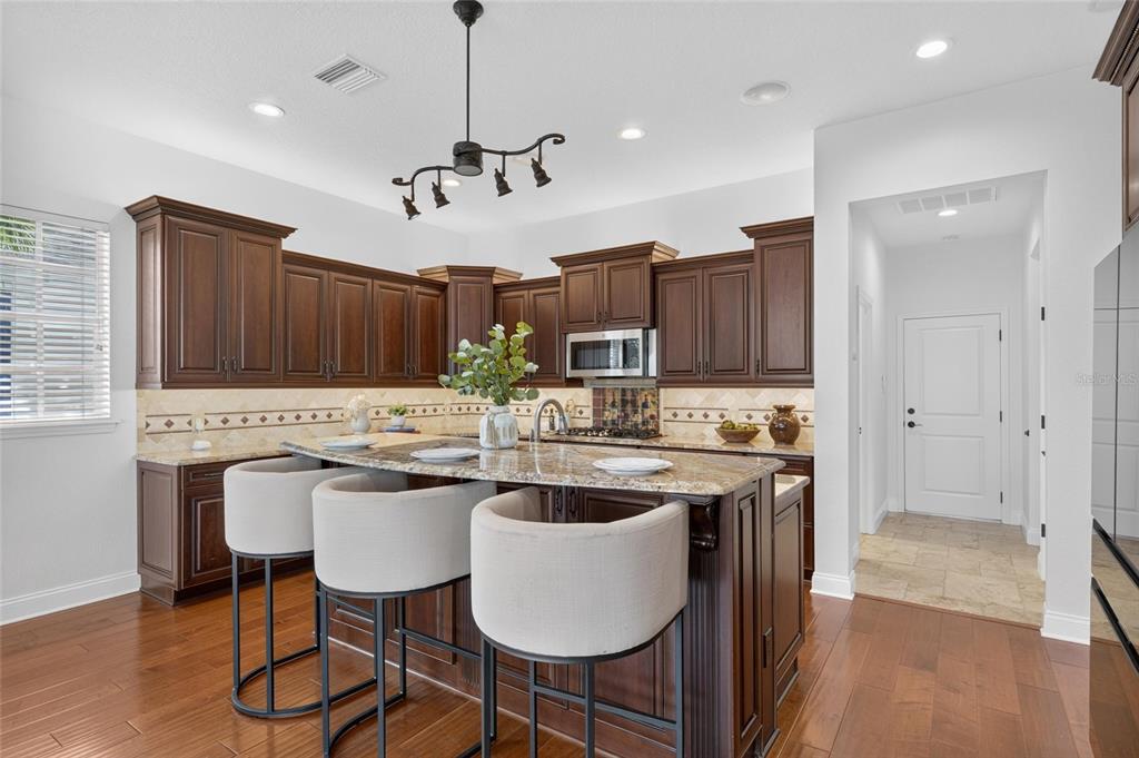 Kitchen with gas range and solid wood cabinetry at 715 Islebay Drive