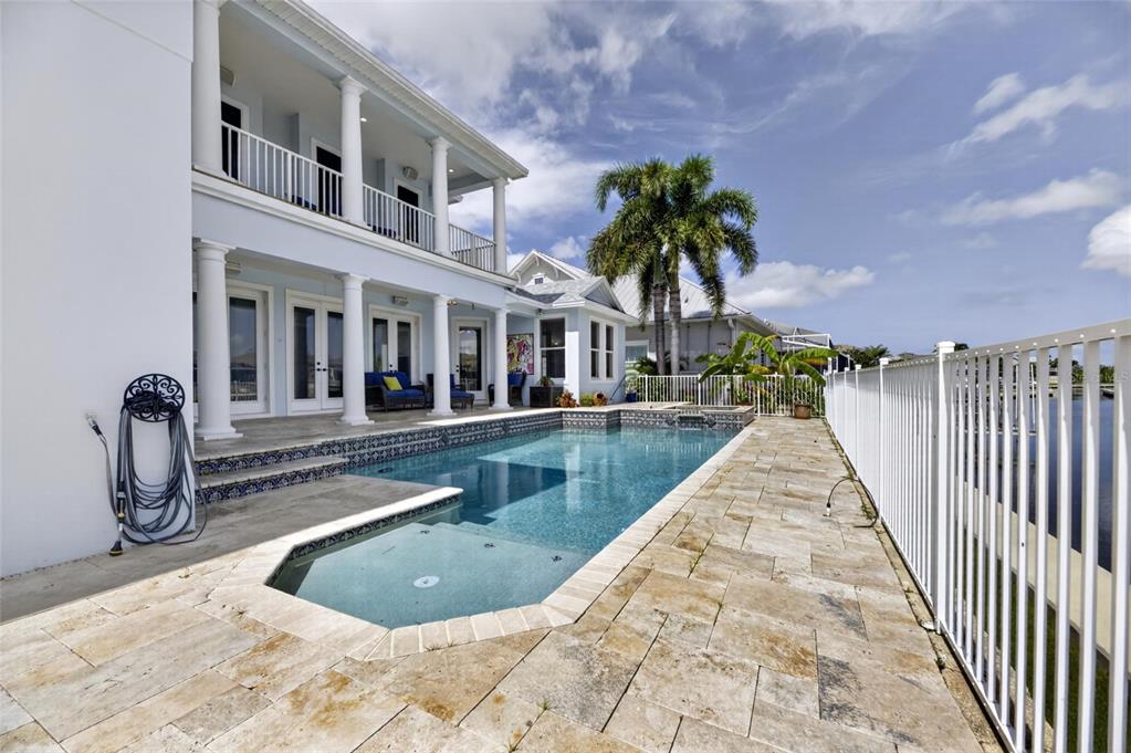 Pool deck and canal view at 715 Islebay Drive Apollo Beach