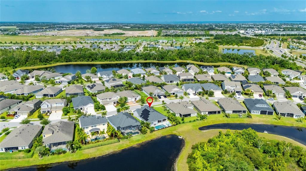 Aerial view of 7322 Paradiso Drive on the lake in Waterset