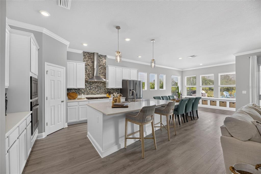 Kitchen with solid wood cabinets, stone counters and island
