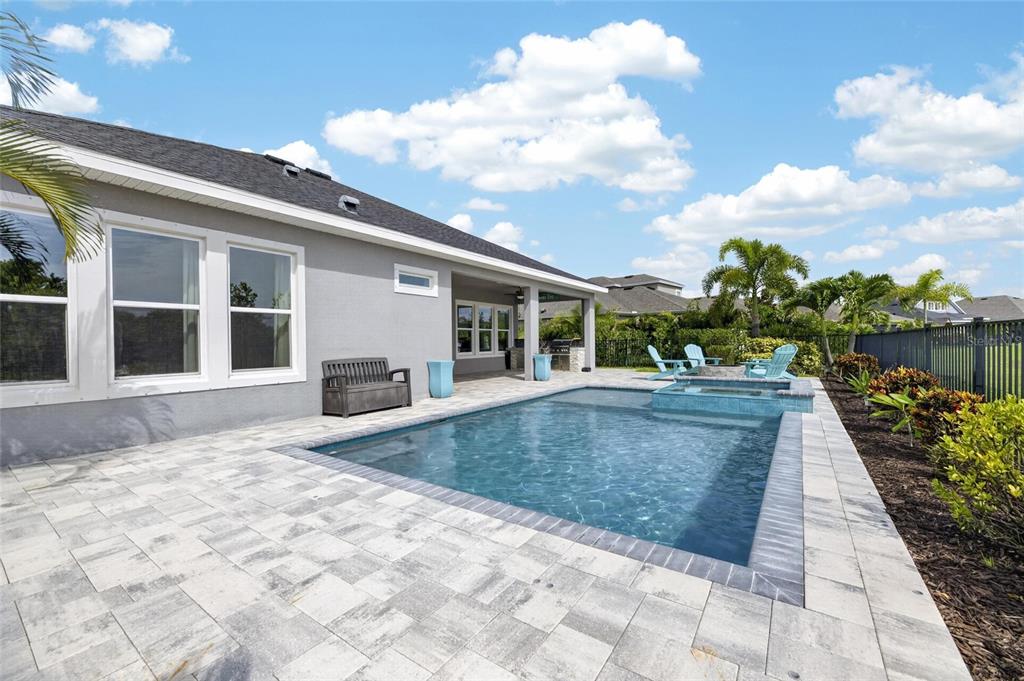 Heated pool and spa overlooking the lake at 7322 Paradiso Drive, Waterset, Apollo Beach