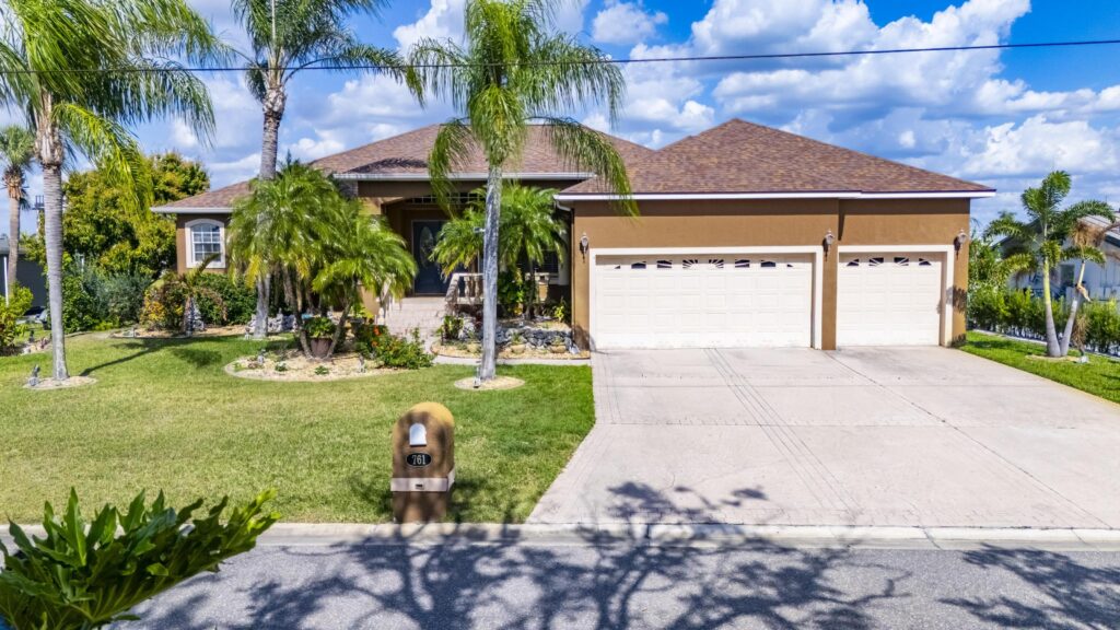 Front elevation of the no-HOA waterfront pool home at 761 Kingston Court in Apollo Beach, Florida