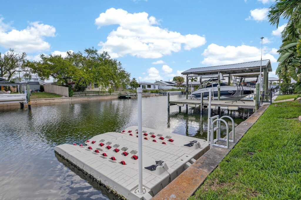 Dock and boat lift on the canal behind 761 Kingston Court in Apollo Beach, Florida
