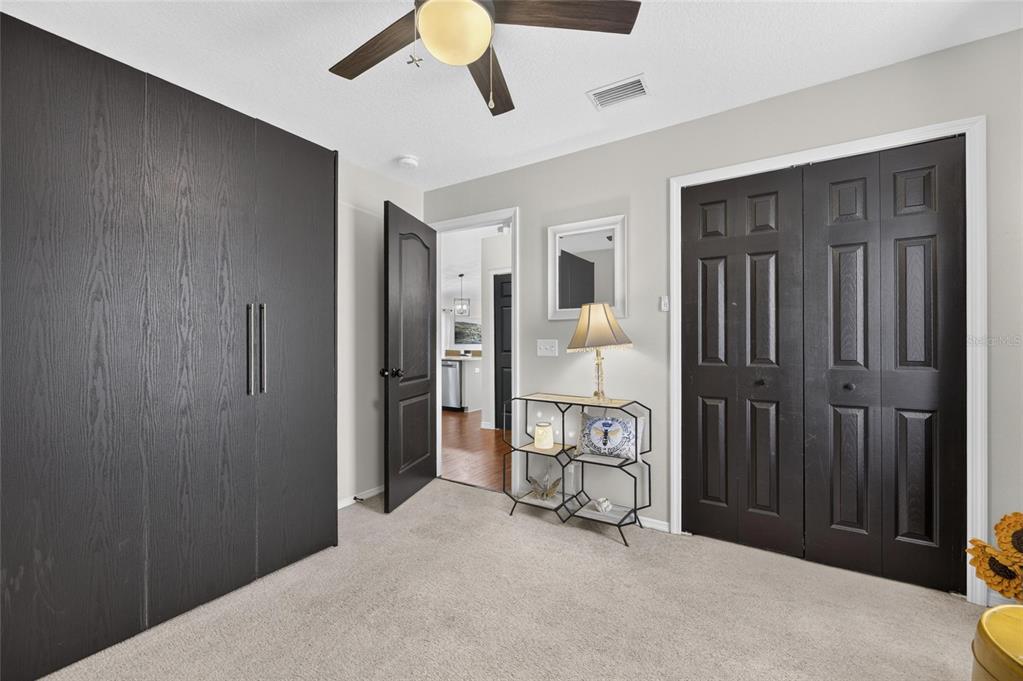 Primary bedroom with wood floors