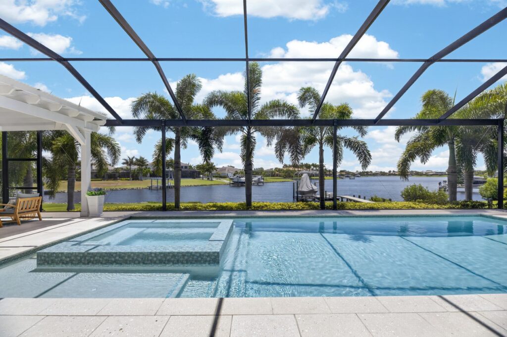 Screened lagoon-front pool at 825 Manns Harbor Drive in MiraBay, Apollo Beach, Florida