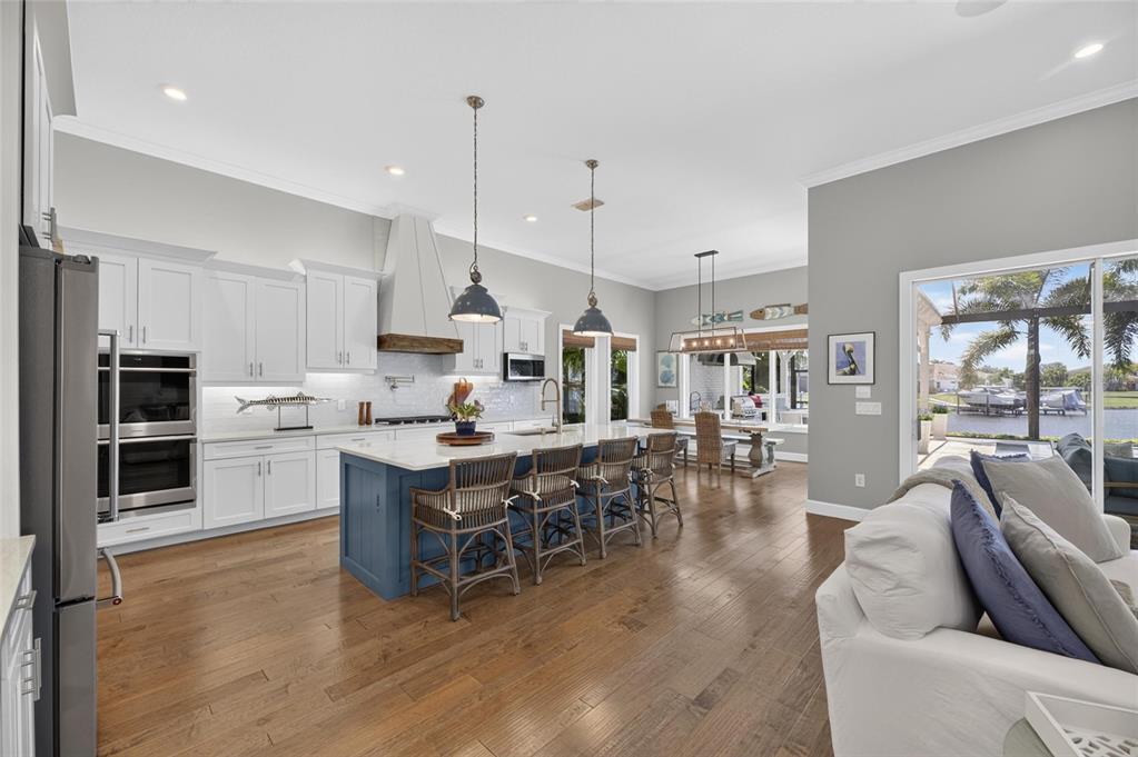 Kitchen with oversized island and gas cooktop at 825 Manns Harbor Drive