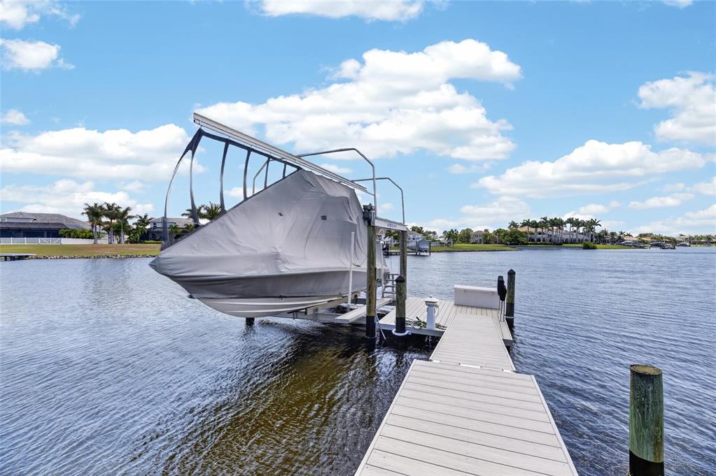 Composite dock with a 13,000 pound boat lift on the MiraBay lagoon at 825 Manns Harbor Drive