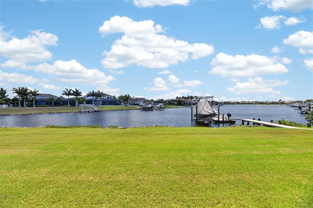 Docks and boat lifts along the MiraBay lagoon near 825 Manns Harbor Drive