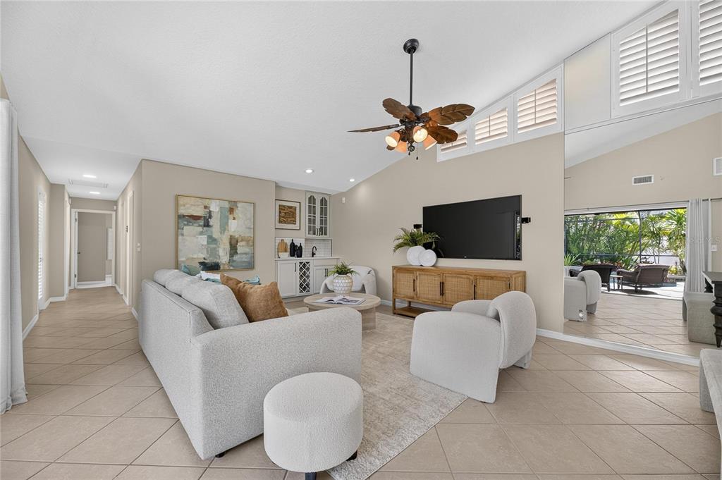 Open living and dining area with skylights