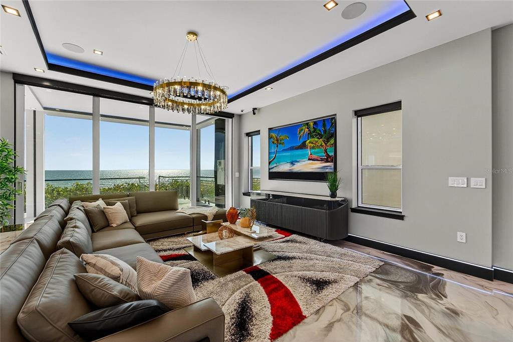 Main living area with a wall of glass facing the Gulf at 9600 Gulf Boulevard