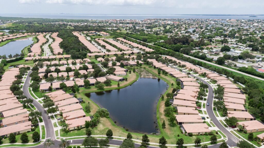 Aerial of Del Webb Southshore Falls homes around a large pond, Apollo Beach
